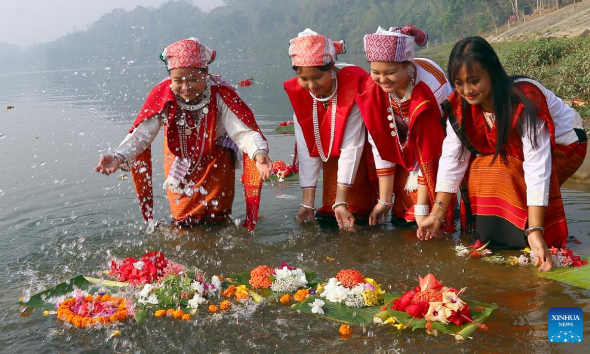 People release floating flowers in a lake to celebrate the Boisabi festival in Chattogram, Bangladesh on April 12, 2023. With this festival, indigenous people in Chattogram Hill Tracts region bid farewell to the old year and welcome the new year. Photo:Xinhua