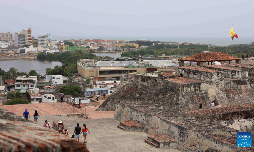 People visit an old castle in the coastal city of Cartagena in northern Colombia on May 4, 2023. (Xinhua/Zhou Shengping)