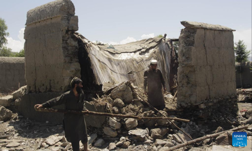 People clear the debris at a flood-affected area in Nangarhar province, Afghanistan, May 6, 2023. Heavy rains and flash floods killed four people and injured 25 others in Afghanistan's eastern Nangarhar province, said a statement of the provincial government released here Saturday. (Photo by Aimal Zahir/Xinhua)