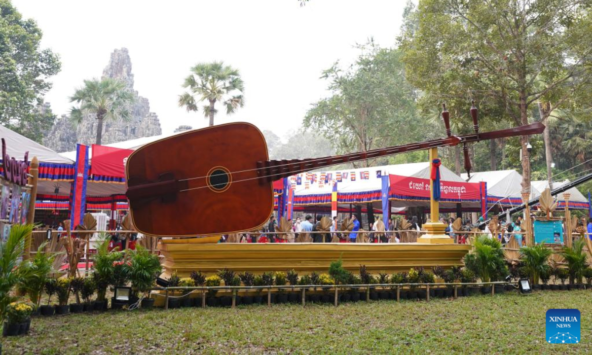 A large Chapei Dang Veng, the long-necked, two-stringed lute, is displayed at the Sankranta festival in Siem Reap province, Cambodia on April 14, 2023. Cambodia kicked off the three-day Sankranta festival, or the Khmer New Year celebration, at the famed Angkor Archeological Park on Friday. Photo:Xinhua