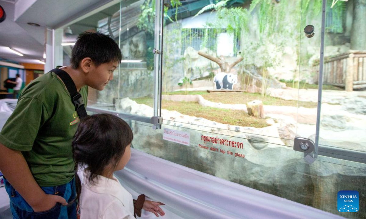 Tourists visit the panda house at Chiang Mai Zoo in Chiang Mai, Thailand, April 26, 2023. China and Thailand would summarize the giant panda cooperation program in the past two decades and discuss further cooperation, Chinese Consul General in Chiang Mai Wu Zhiwu said at a memorial event of giant panda 