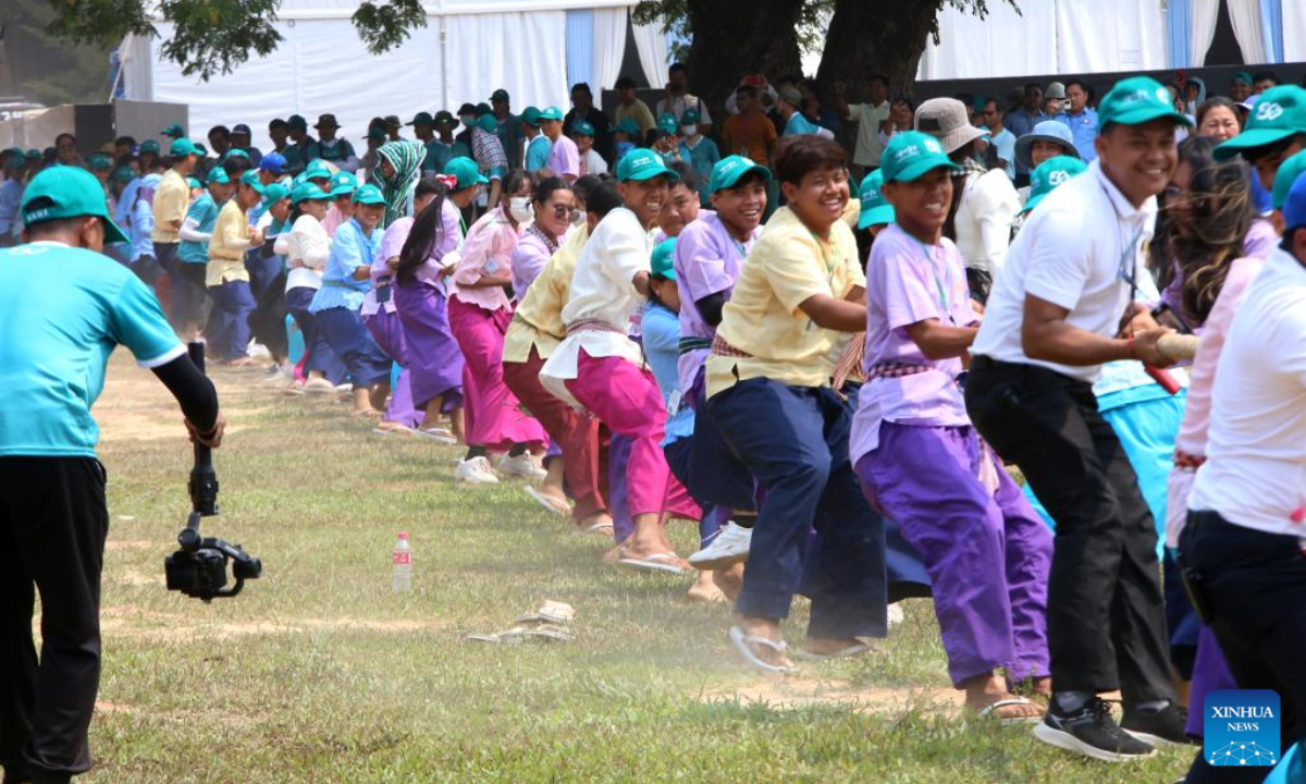 People play traditional tug-of-war game at the Sankranta festival in Siem Reap province, Cambodia on April 14, 2023. Cambodia kicked off the three-day Sankranta festival, or the Khmer New Year celebration, at the famed Angkor Archeological Park on Friday. Photo:Xinhua