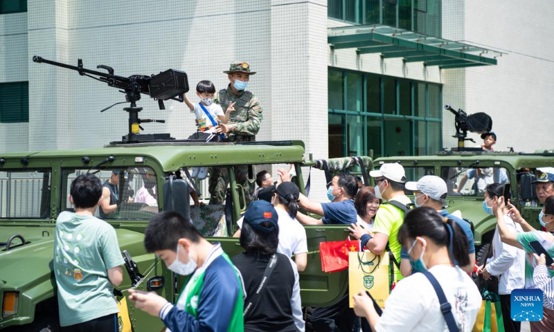 Citizens attend an open day event at the barracks of Chinese People's Liberation Army Garrison stationed in the Macao Special Administrative Region on Taipa Island in Macao, south China, April 30, 2023. This was the 17th time that the barracks had been opened to the public since 2005, helping with communication between the garrison and local residents. (Xinhua/Cheong Kam Ka)