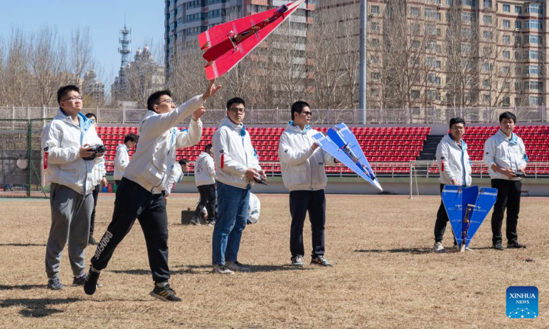 Students from the aviation model association of Harbin Institute of Technology launch a model airplane on campus in Harbin, capital of northeast China's Heilongjiang Province, on April 22, 2023. Activities are held in Harbin Institute of Technology to celebrate the upcoming Space Day of China, which falls on April 24. (Xinhua/Xie Jianfei)