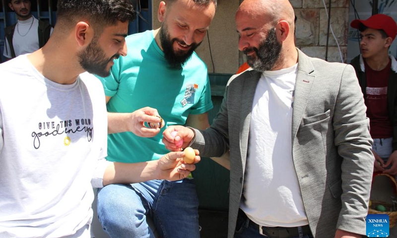 A group of men play egg tapping during the celebration of Easter in the city of Hasbaya, south Lebanon, April 16, 2023.(Photo: Xinhua)