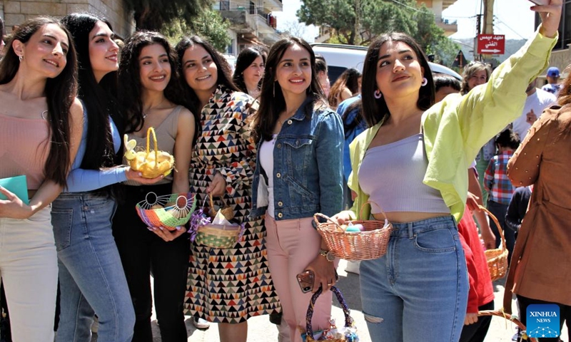 A group of girls take a selfie during the celebration of Easter in the city of Hasbaya, south Lebanon, April 16, 2023.(Photo: Xinhua)