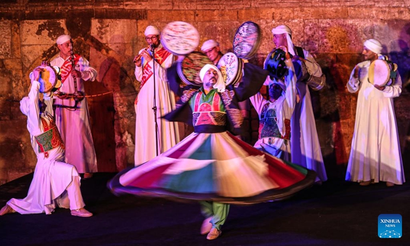 Dancers perform Tanoura, a traditional Egyptian folk dance, during the holy month of Ramadan at the Sultan Al-Ghuri complex in Cairo, Egypt, on April 12, 2023. Tanoura is an Arabic word, which means skirt in English. Tanoura dance is a traditional folk dance in Egypt, where the dancer in colorful skirts spins to the tunes of songs.(Photo: Xinhua)