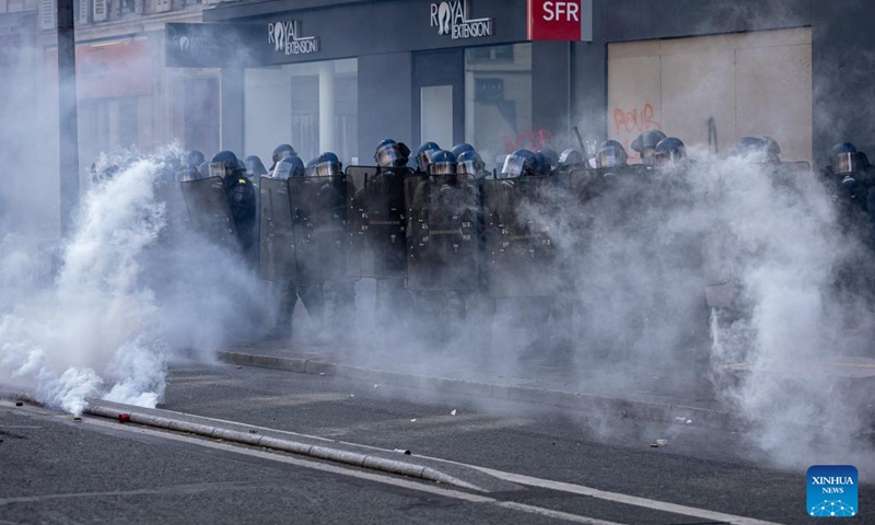 French gendarmes and CRS riot police stand guard during a demonstration against a pensions reform plan in Paris, France, on April 13, 2023. Around 380,000 people participated in the 12th nationwide general mobilization organized by the unions against the government's pension reform plan, the French Interior Ministry said on Thursday.(Photo: Xinhua)