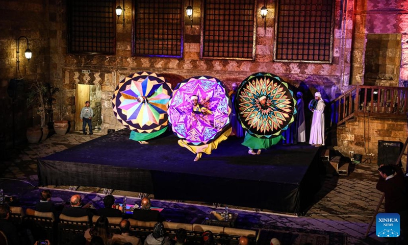 Dancers perform Tanoura, a traditional Egyptian folk dance, during the holy month of Ramadan at the Sultan Al-Ghuri complex in Cairo, Egypt, on April 12, 2023. Tanoura is an Arabic word, which means skirt in English. Tanoura dance is a traditional folk dance in Egypt, where the dancer in colorful skirts spins to the tunes of songs.(Photo: Xinhua)