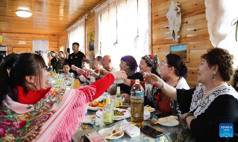 People of Russian ethnic group gather to celebrate the Russian Easter festival in Enhe Township of Hulun Buir, north China's Inner Mongolia Autonomous Region, April 16, 2023. The Russian Easter festival celebrated by people of Russian ethnic group has been listed as China's national intangible cultural heritage. Various feasts and activities are held during the week-long celebration. (Xinhua/Wang Kaiyan)