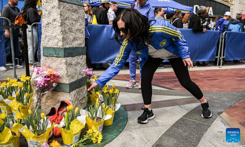 A woman places flowers at the memorial site of the Boston Marathon bombings in Boston, the United States, April 15, 2023. April 15, 2023 marks the 10-year anniversary of the Boston Marathon Bombings back in 2013.

On April 15, 2013, two bombs went off near the finish line of the Boston Marathon, killing three people and wounded more than 260 others. (Photo by Ziyu Julian Zhu/Xinhua)