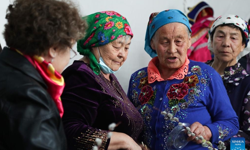 People of Russian ethnic group gather to celebrate the Russian Easter festival in Enhe Township of Hulun Buir, north China's Inner Mongolia Autonomous Region, April 16, 2023. The Russian Easter festival celebrated by people of Russian ethnic group has been listed as China's national intangible cultural heritage. Various feasts and activities are held during the week-long celebration. (Xinhua/Wang Kaiyan)