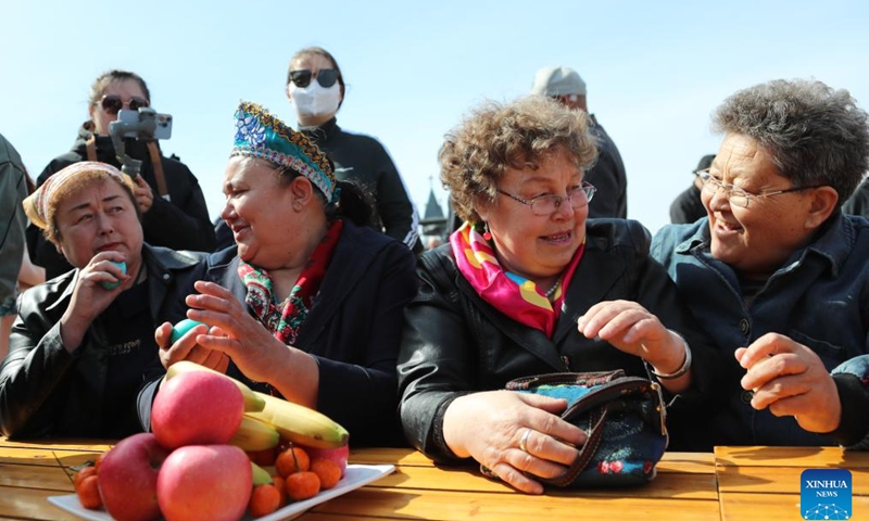 People of Russian ethnic group gather to celebrate the Russian Easter festival in Enhe Township of Hulun Buir, north China's Inner Mongolia Autonomous Region, April 16, 2023. The Russian Easter festival celebrated by people of Russian ethnic group has been listed as China's national intangible cultural heritage. Various feasts and activities are held during the week-long celebration. (Xinhua/Wang Kaiyan)