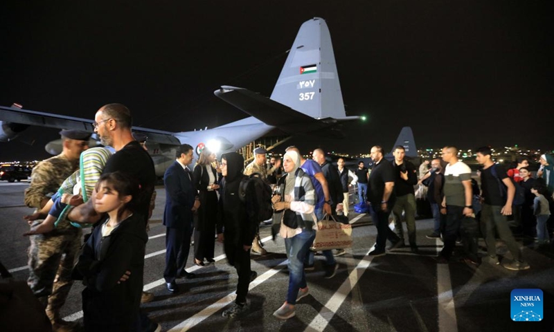 People evacuated from Sudan arrive at Marka Military Airport in Amman, Jordan, on April 24, 2023. Jordan evacuated 343 people from Sudan on Monday, the state-run Petra news agency reported. A total of 343 Jordanians, Palestinians, Iraqis, Syrians and Germans arrived in Jordan early Monday in four planes of the Royal Jordanian Air Forces, said the report.(Photo: Xinhua)