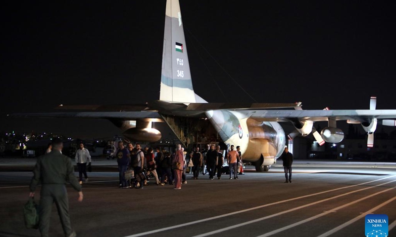 People evacuated from Sudan arrive at Marka Military Airport in Amman, Jordan, on April 24, 2023. Jordan evacuated 343 people from Sudan on Monday, the state-run Petra news agency reported. A total of 343 Jordanians, Palestinians, Iraqis, Syrians and Germans arrived in Jordan early Monday in four planes of the Royal Jordanian Air Forces, said the report.(Photo: Xinhua)