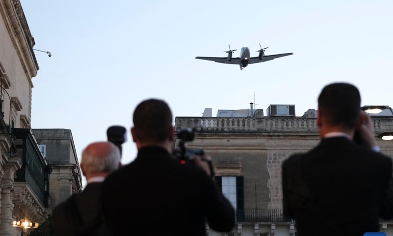 An aircraft flies over the sky during a parade in Valletta, Malta, on April 19, 2023. The Armed Forces of Malta (AFM) commemorated its 50th anniversary with a grand parade in Valletta on Wednesday.(Photo: Xinhua)