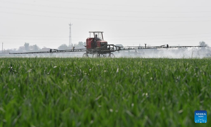 A farmer sprays pesticide in a wheat field with agricultural machinery in Zhangxiang Village, Heguo Township of Nanhe District in Xingtai City, north China's Hebei Province, April 19, 2023. As the winter wheat enters the heading stage in central and southern Hebei Province, local agricultural departments have been guiding farmers to carry out wheatland management on time to secure a bumper summer harvest.(Photo: Xinhua)