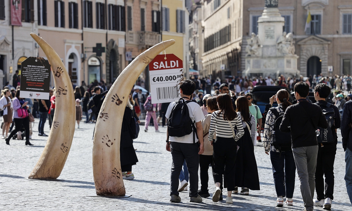 An installation of huge tusks, created by the WWF (World Wildlife Fund), is seen in Piazza di Spagna, Rome, Italy on Earth Day, 22 April 2023. The WWF is drawing attention to crimes against nature by creating a 