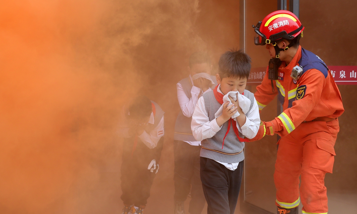 Students are guided to conduct an emergency evacuation drill in Huaibei, East China's Anhui Province on May 10, 2023, two days ahead of China's Disaster Prevention and Reduction Day. Photo: VCG