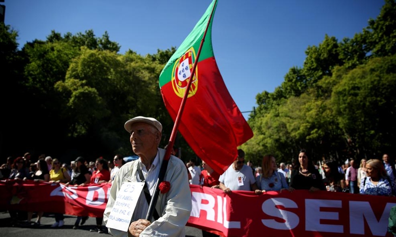 A man takes part in a parade to mark the 49th anniversary of the Carnation Revolution in Lisbon, Portugal, on April 25, 2023.(Photo: Xinhua)