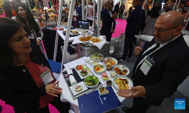 Exhibitors talk at a stand at the HORECA Lebanon in Beirut, Lebanon, on April 25, 2023. About 160 Lebanese and international exhibitors attended the HORECA Lebanon, an annual trade fair for the hospitality industry, which kicked off here on Tuesday.(Photo: Xinhua)