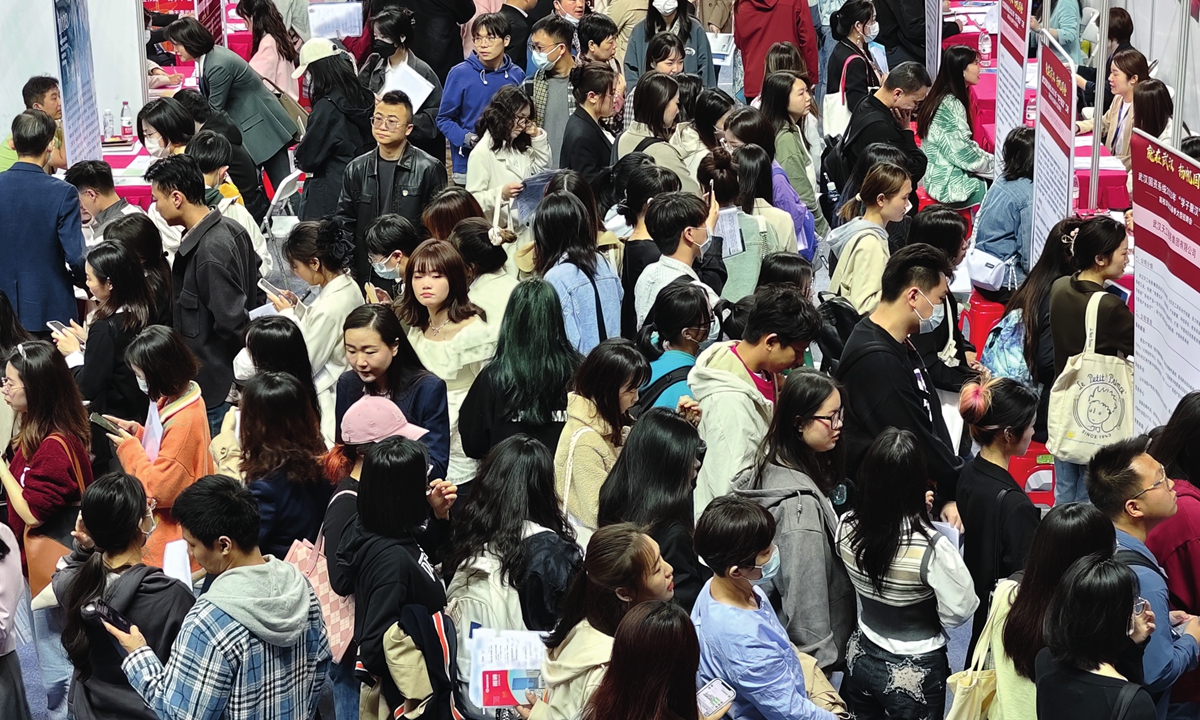 Young job-seekers crowd a labor market at Wuhan Jianghan University on April 23, 2023. Photo: VCG