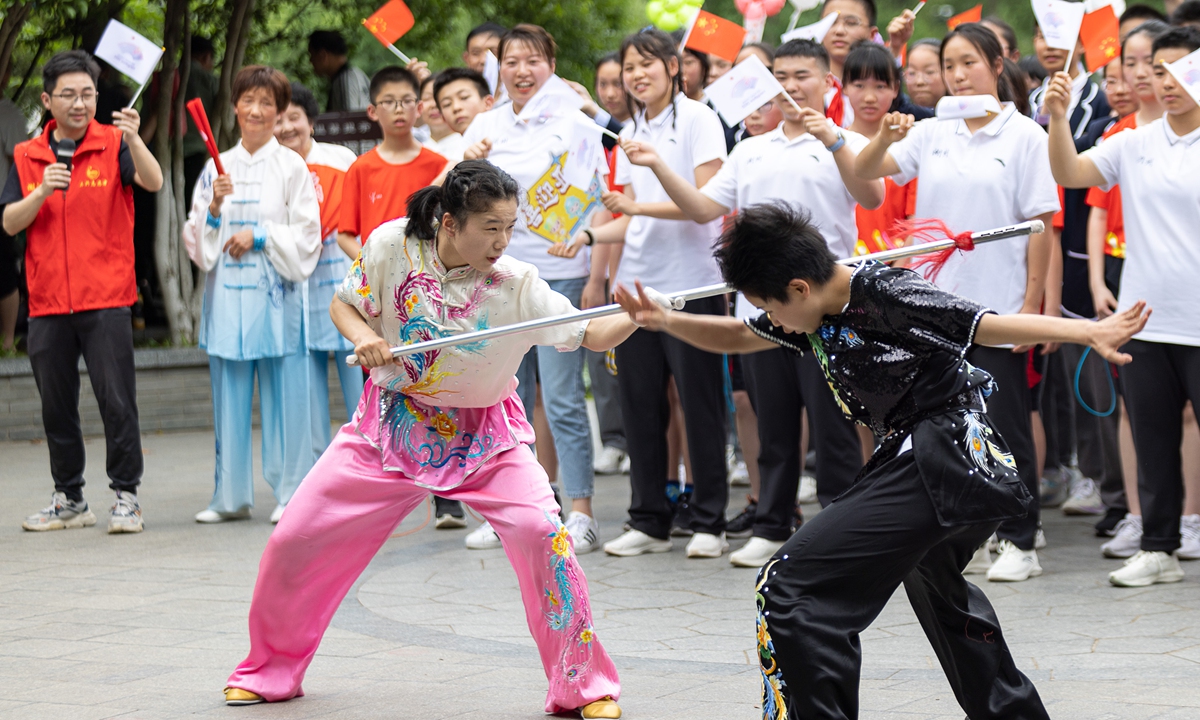 People watch a martial arts performance during a flash mob event to welcome the Asian Games on May 4, 2023 in Huzhou, East China's Zhejiang Province. The Asian Games will be held from September 23 to October 8 in Hangzhou, Zhejiang Province. Photo: VCG