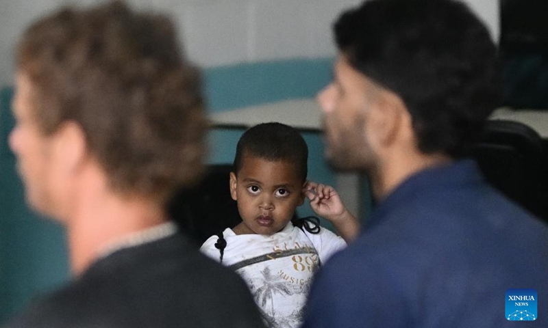 A migrant kid reacts at a shelter in city of Danli, southern Honduras, May 8, 2023. Danli in El Paraiso province bordering on Nicaragua has become a waystation on the travel route for thousands of migrants, most of them from South America or the Caribbean, who cross through Honduras en route to the north.(Photo: Xinhua)