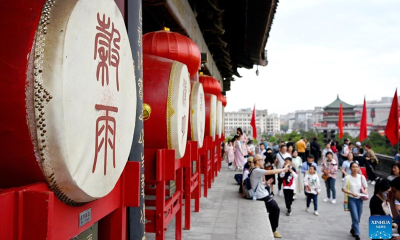 Tourists visit the Drum Tower in Xi'an, northwest China's Shaanxi Province, May 1, 2023. Xi'an, a city with over 3,100 years of history, served as the capital for 13 dynasties in Chinese history. It is also home to the world-renowned Terracotta warriors created in the Qin Dynasty (221-207 BC). The Drum Tower was initially built in 1380 during the reign of Emperor Hongwu of the Ming Dynasty (1368-1644).(Photo: Xinhua)