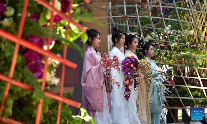 Students from the Liaoning Agricultural Technical College demonstrate flower arrangement artworks in Shenyang, northeast China's Liaoning Province, May 10, 2023. Teachers and professionals in gardening and floriculture presented flower arrangement artworks at the Liaoning Agricultural Technical College on Wednesday.(Photo: Xinhua)