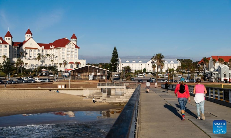 People walk near the coast in Port Elizabeth, South Africa, May 11, 2023.(Photo: Xinhua)