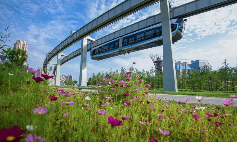 This photo taken on May 9, 2023 shows a train running on the suspension monorail line in Wuhan, central China's Hubei Province. The suspension monorail line in Wuhan has undergone a running test before being put into trial operation.(Photo: Xinhua)