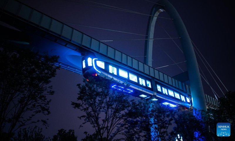 This photo taken on May 9, 2023 shows a train running on the suspension monorail line in Wuhan, central China's Hubei Province. The suspension monorail line in Wuhan has undergone a running test before being put into trial operation.(Photo: Xinhua)