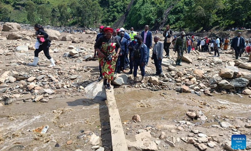 People gather at an area hit by flooding and landslides in Kalehe, South Kivu Province, the Democratic Republic of the Congo (DRC), on May 9, 2023. Flooding and landslides brought by torrential rains in the eastern Democratic Republic of the Congo (DRC) have killed 438 villagers, local media reported Thursday, citing a government spokesperson.(Photo: Xinhua)
