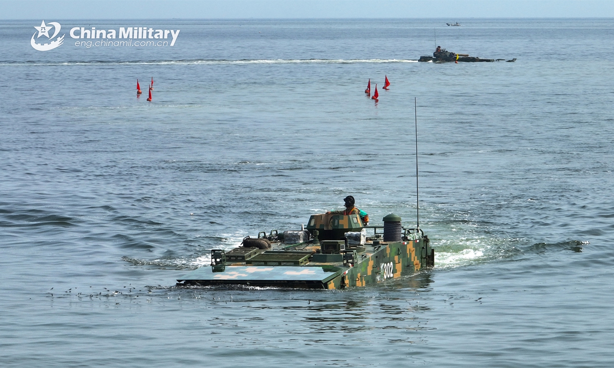 An amphibious armored vehicle attached to a brigade of the PLA 73rd Group Army makes its way during a maritime driving training exercise in late April, 2023.  (eng.chinamil.com.cn/Photo by Zheng Yi)