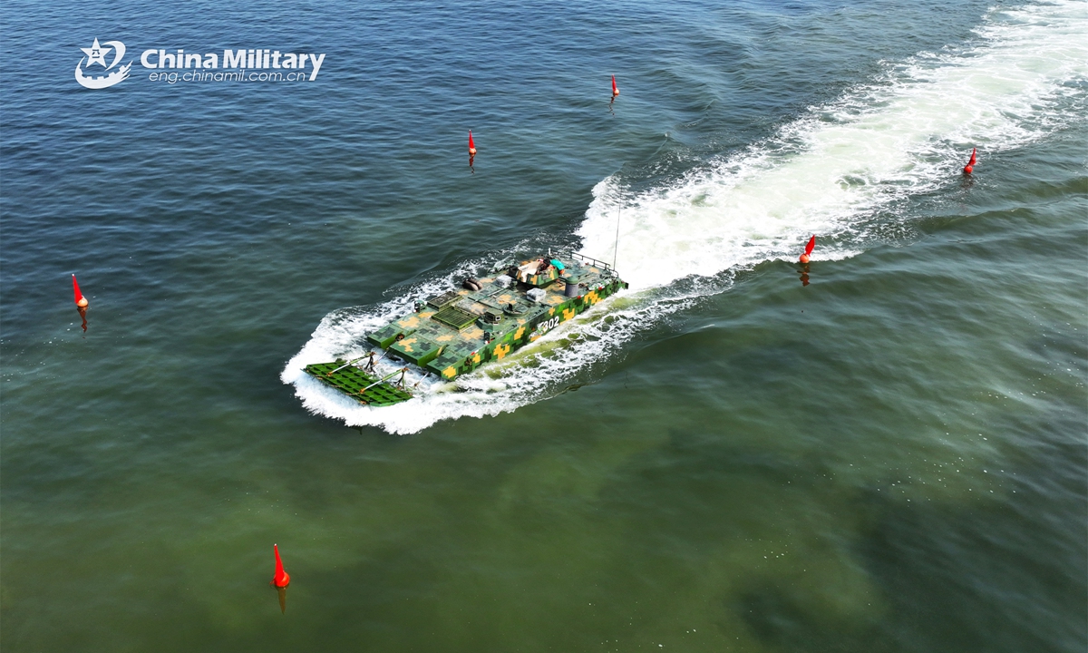 An amphibious armored vehicle attached to a brigade of the PLA 73rd Group Army makes its way during a maritime driving training exercise in late April, 2023.  (eng.chinamil.com.cn/Photo by Zheng Yi)