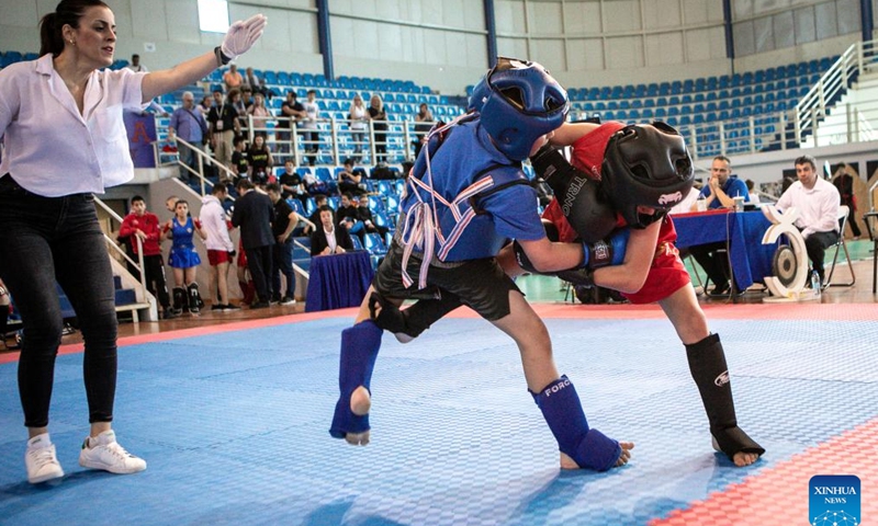 Young practitioners of Sanda, a style of competitive Wushu, compete during the 1st European Chin Woo Wushu Kung Fu Open Championship and Chinese Cultural Festival in Athens, Greece on May 27, 2023.

The event kicked off on Saturday in Athens, offering a taste of Chinese culture to local audiences. (Photo by Panagiotis Moschandreou/Xinhua)