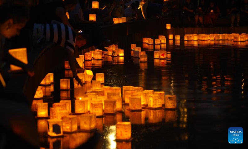 People attend the Water Lantern Festival held in Houston, Texas, the United States, May 27, 2023. (Xinhua/Xu Jianmei)