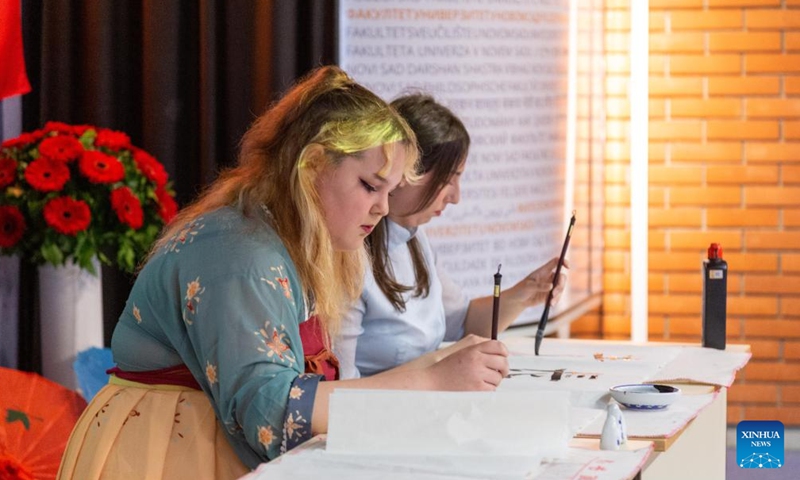 Students display the art of Chinese calligraphy during an event to celebrate the ninth anniversary of the Confucius Institute at the University of Novi Sad in Novi Sad, Serbia, May 27, 2023. The Confucius Institute at the University of Novi Sad marked its ninth anniversary on Saturday with a series of cultural activities. (Xinhua/Shi Zhongyu)