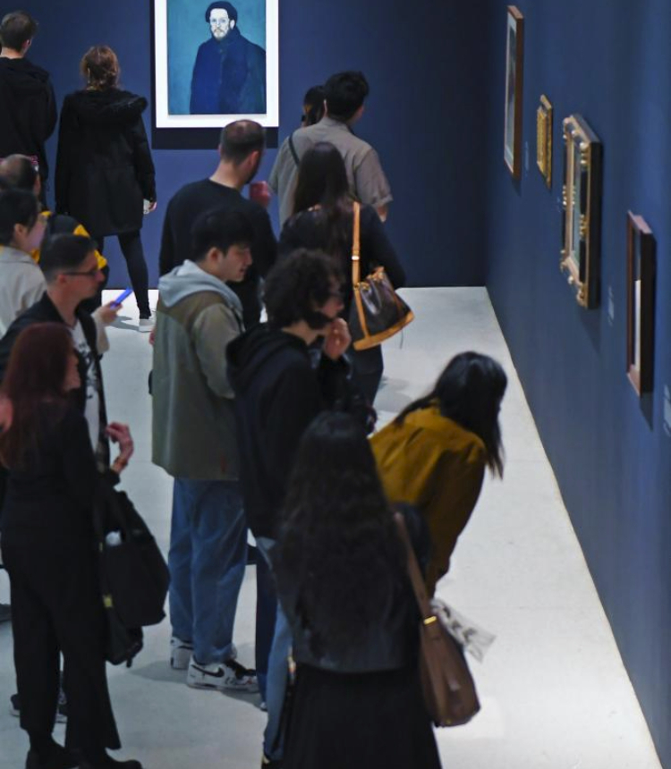 Visitors view Pablo Picasso's artworks during Young Picasso in Paris exhibition at Solomon R. Guggenheim Museum in New York, the United States, on May 20, 2023. Coinciding with the 50th anniversary of Pablo Picasso's death, the exhibition, held here from May 12 to Aug. 6, explores a critical juncture in his artistic development, as he encountered novel contemporary subjects and styles. (Xinhua/Li Rui)