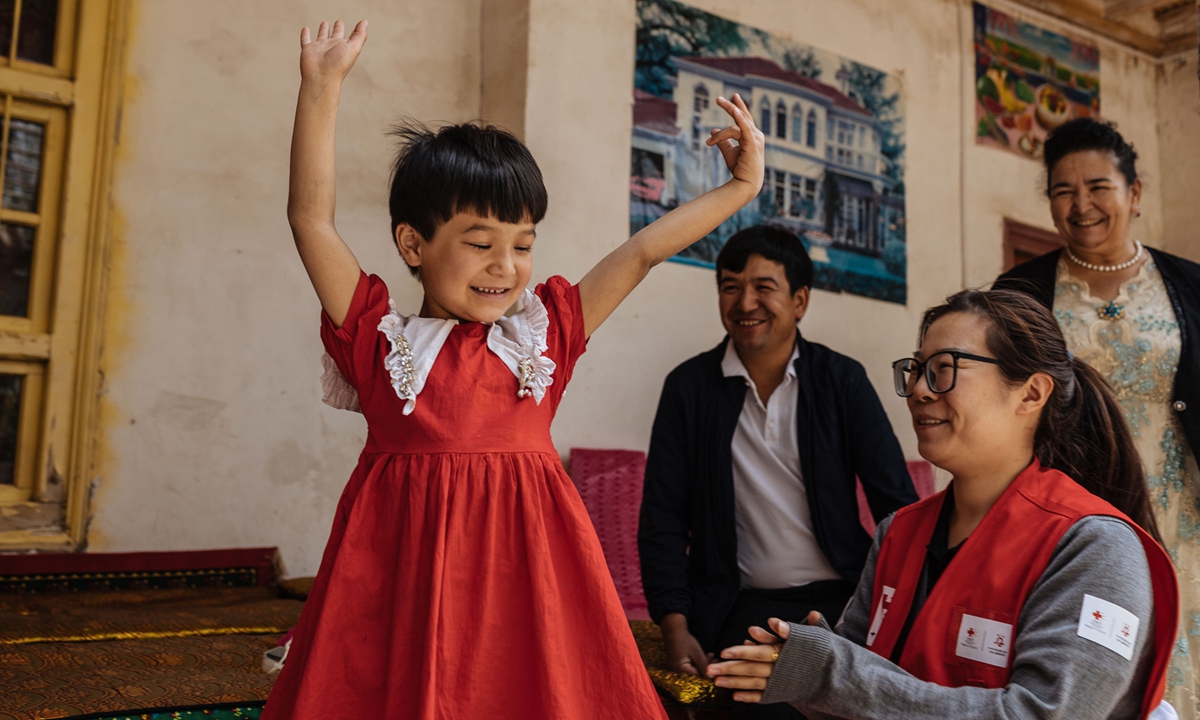 A little girl who received free surgery in February performs Xinjiang's folk dance during a doctor's home visit in Jiashi county, Northwest China's Xinjiang Uygur Autonomous Region, on May 12, 2023. Photo: Li Hao/GT