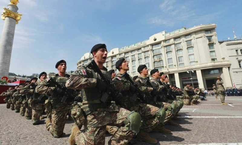 Georgian military personnel in formation are pictured during the Independence Day celebration at the Freedom Square in Tbilisi, capital of Georgia, on May 26, 2023. (Photo by Tamuna Kulumbegashvili/Xinhua)