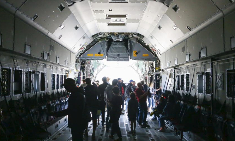 People visit an Airbus A400M transport aircraft during an open day at the Melsbroek Air Base in Steenokkerzeel, Belgium, May 27, 2023. Belgian Air Force's 15th Air Transport Wing and the Directorate of Air Support (DAFA) celebrate their 75th and 30th anniversary with two-day public open day activities on May 27 and 28. (Xinhua/Zheng Huansong)