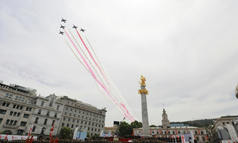 Aircraft fly over the Freedom Square during the Independence Day celebration in Tbilisi, capital of Georgia, on May 26, 2023. (Photo by Tamuna Kulumbegashvili/Xinhua)