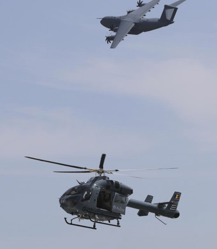 Belgian Air Force's Airbus A400M transport aircraft is seen with a Belgian Federal Police's MD902 Explorer helicopter during an open day at the Melsbroek Air Base in Steenokkerzeel, Belgium, May 27, 2023. Belgian Air Force's 15th Air Transport Wing and the Directorate of Air Support (DAFA) celebrate their 75th and 30th anniversary with two-day public open day activities on May 27 and 28. (Xinhua/Zheng Huansong)