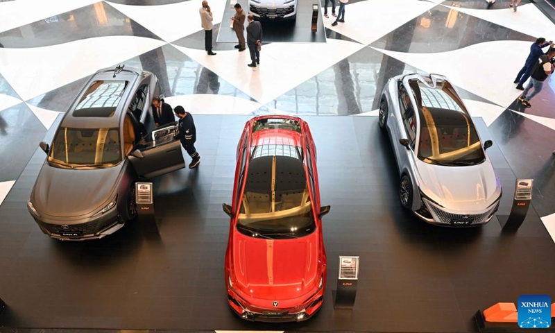 People visit a Chinese automobile exhibition in Hawalli Governorate, Kuwait, June 11, 2023. A Chinese-brand automobile exhibition opened in Hawalli Governorate on Sunday. Chinese automotive enterprises such as Dongfeng, Chang'an, Chery showed up with different vehicle models. The exhibition will continue until June 18. (Photo by Asad/Xinhua)