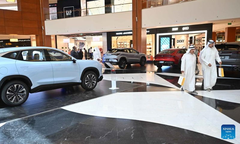 People visit a Chinese automobile exhibition in Hawalli Governorate, Kuwait, June 11, 2023. A Chinese-brand automobile exhibition opened in Hawalli Governorate on Sunday. Chinese automotive enterprises such as Dongfeng, Chang'an, Chery showed up with different vehicle models. The exhibition will continue until June 18. (Photo by Asad/Xinhua)