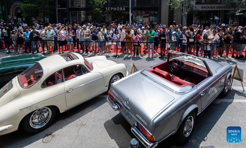 People visit the 2023 Yorkville Exotic Car Show in Toronto, Canada, on June 18, 2023. The annual event was held here on Sunday to celebrate Father's Day with about 100 cars on display. (Photo by Zou Zheng/Xinhua)