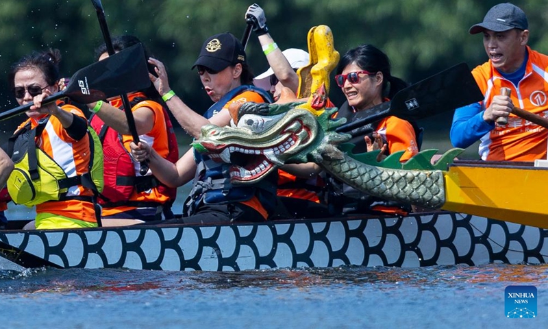 A dragon boat bumps into another one during a race of the 2023 Toronto International Dragon Boat Race Festival in Toronto, Canada, on June 17, 2023. This annual two-day event kicked off here on Saturday with hundreds of participants from around the world participating. (Photo by Zou Zheng/Xinhua)