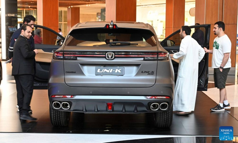 People visit a Chinese automobile exhibition in Hawalli Governorate, Kuwait, June 11, 2023. A Chinese-brand automobile exhibition opened in Hawalli Governorate on Sunday. Chinese automotive enterprises such as Dongfeng, Chang'an, Chery showed up with different vehicle models. The exhibition will continue until June 18. (Photo by Asad/Xinhua)